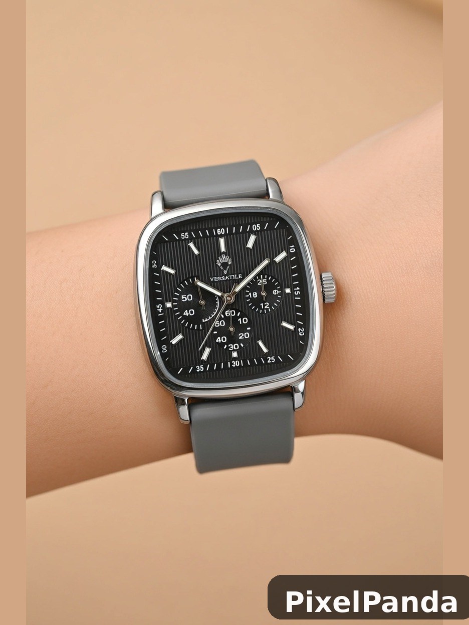 Square watch with black dial and gray rubber strap on wrist