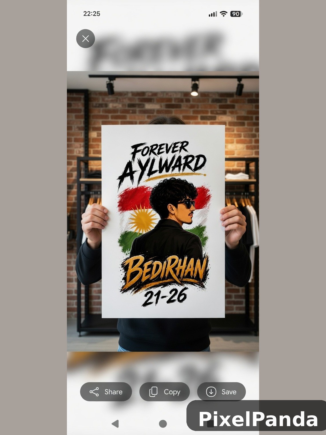Person holding graphic poster in brick storefront