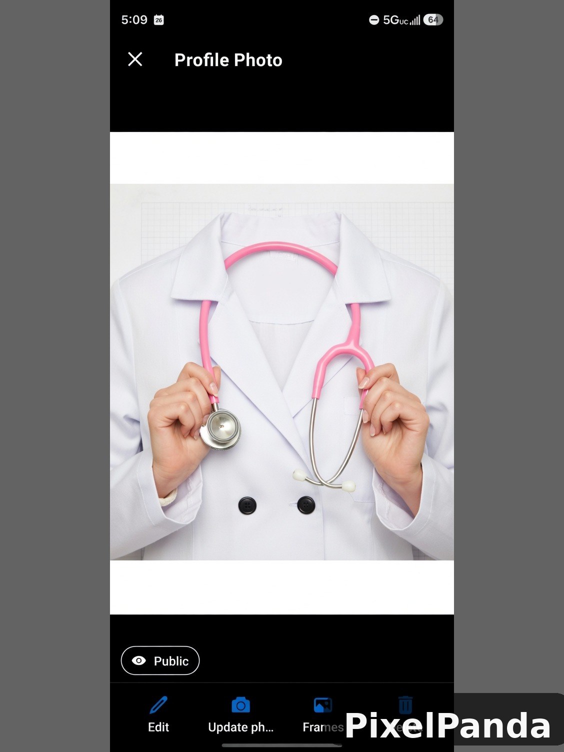 Person in white coat holding pink stethoscope