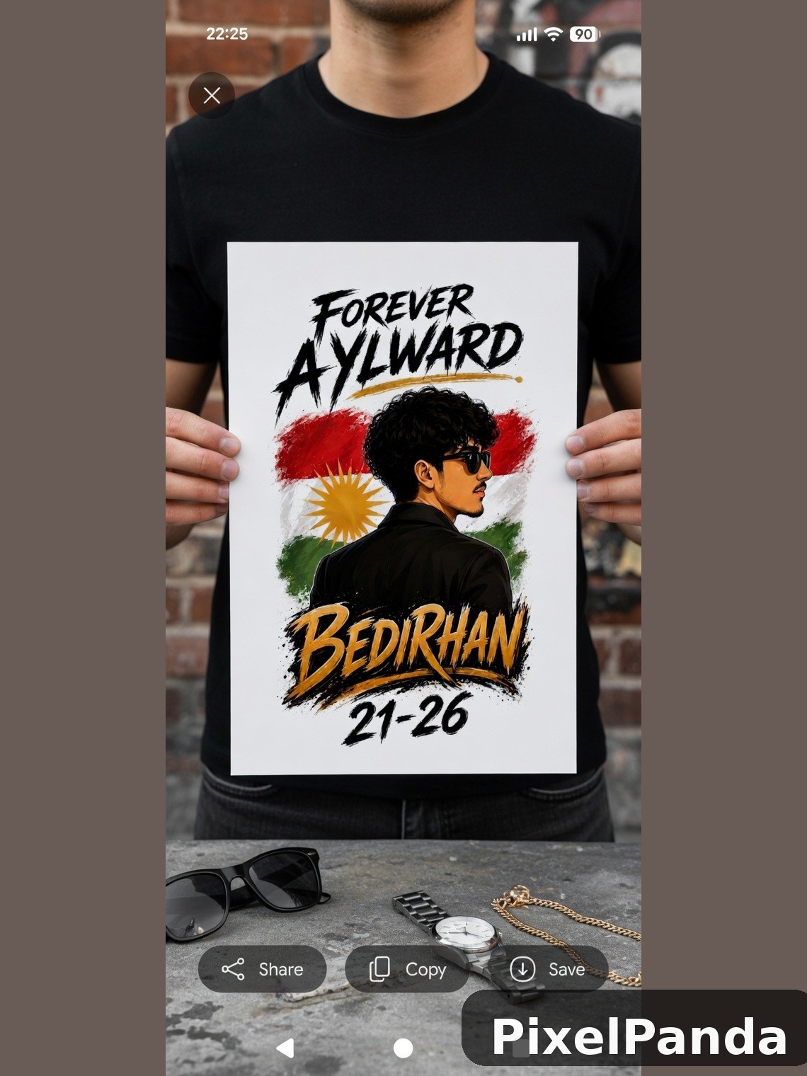 Person holding printed poster with portrait and Kurdish flag design