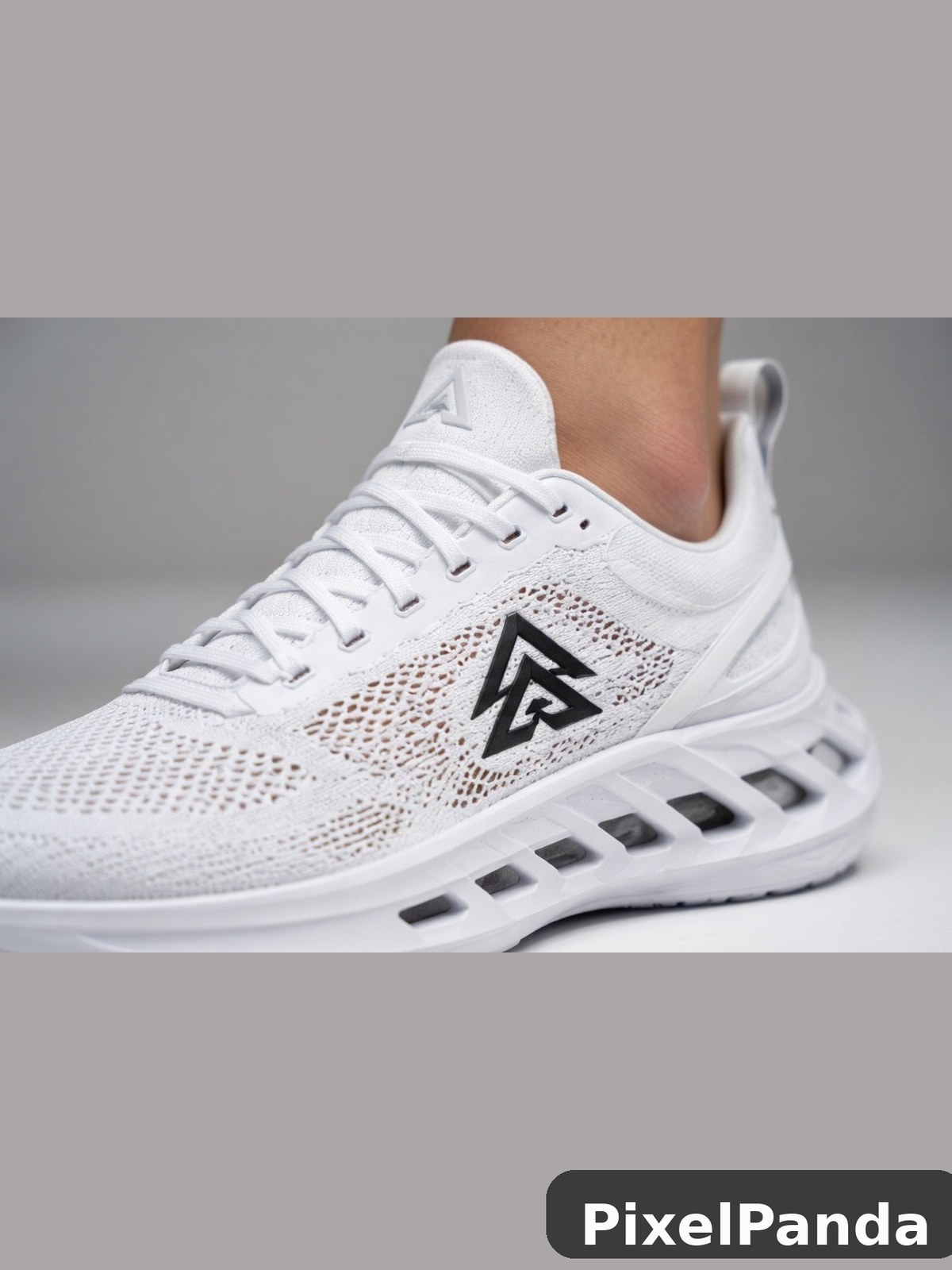 White mesh running shoe with black geometric logo detail