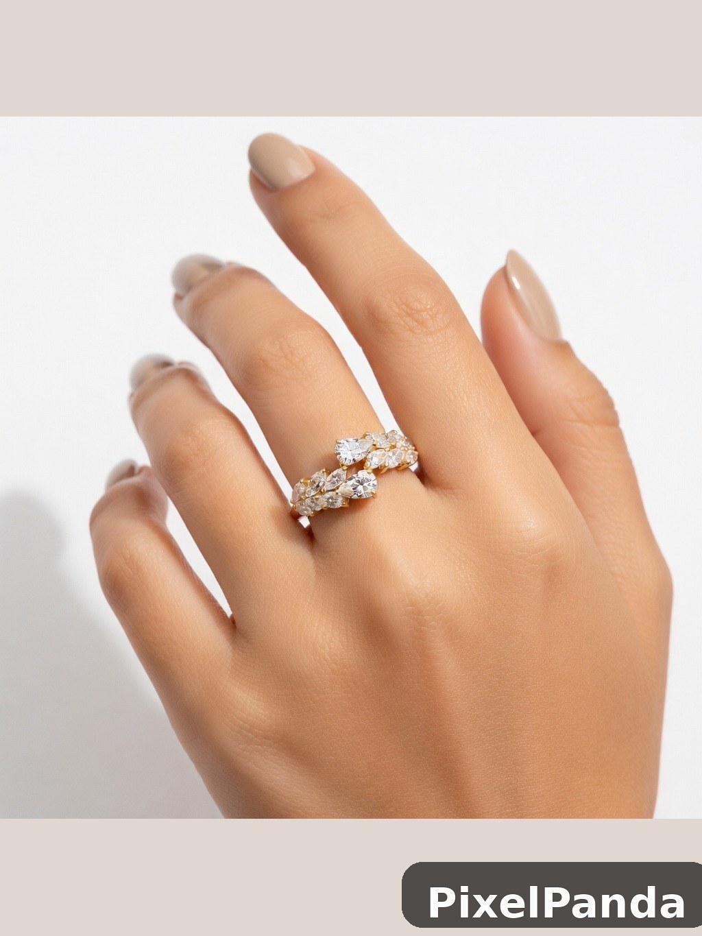 Hand displaying diamond cluster engagement ring with natural nails