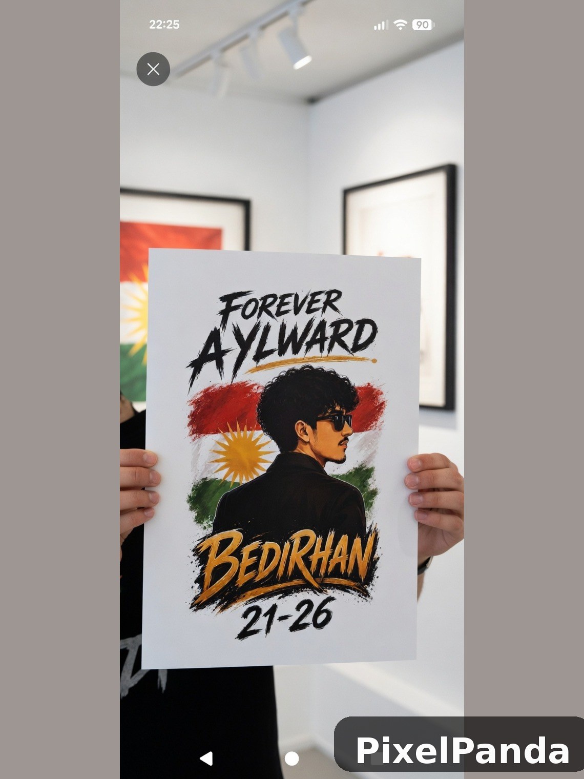 Person holding poster with profile illustration and text in gallery