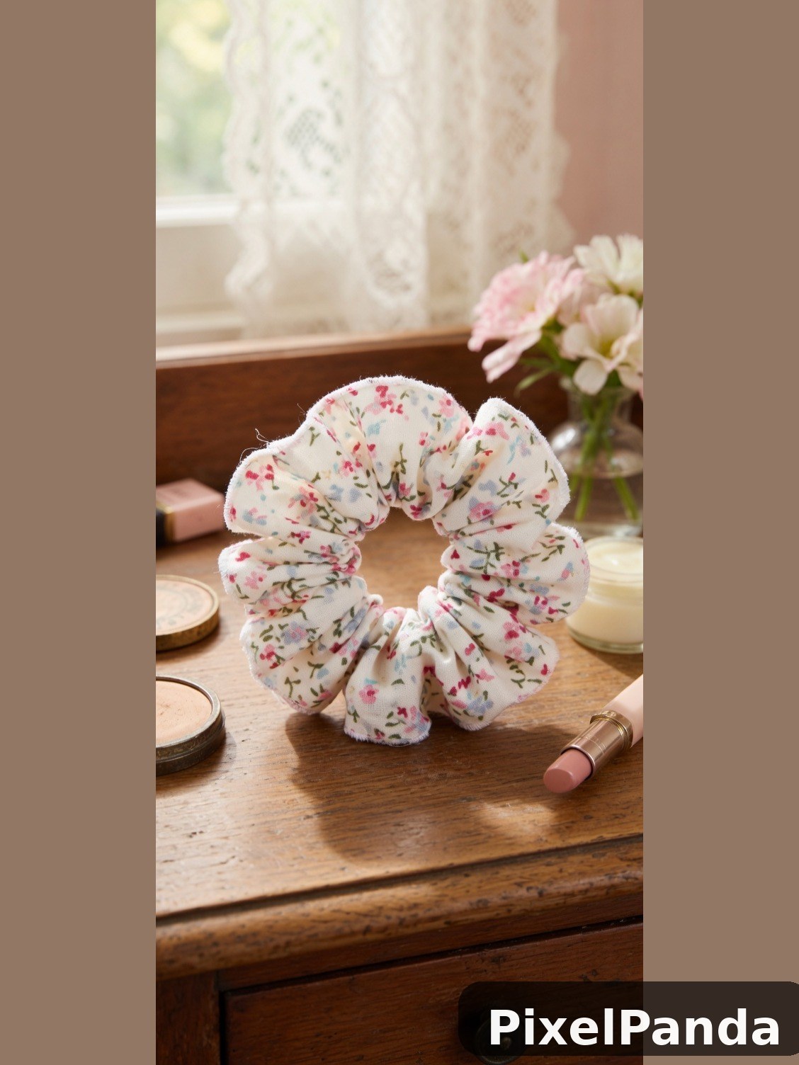 Floral fabric hair scrunchie on wooden vanity with cosmetics
