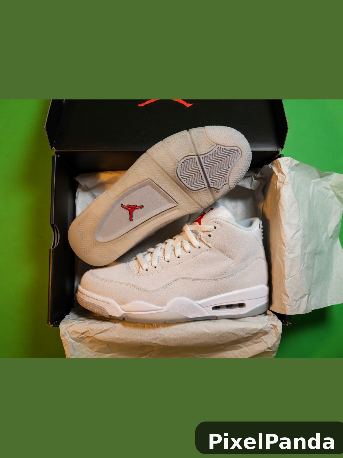 Cream leather high-top sneaker with red logo in open box