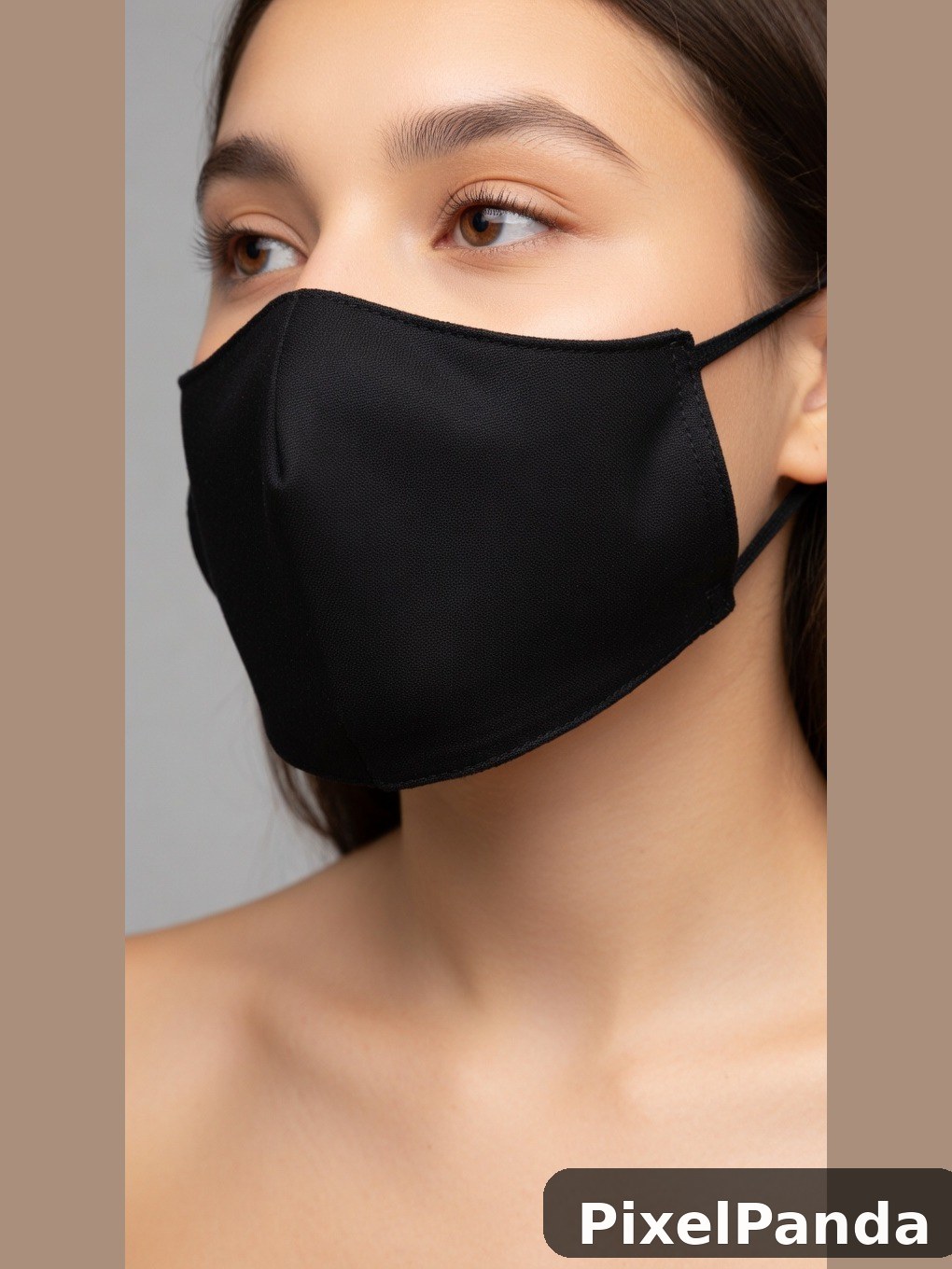 Person wearing black fabric face mask in three-quarter view