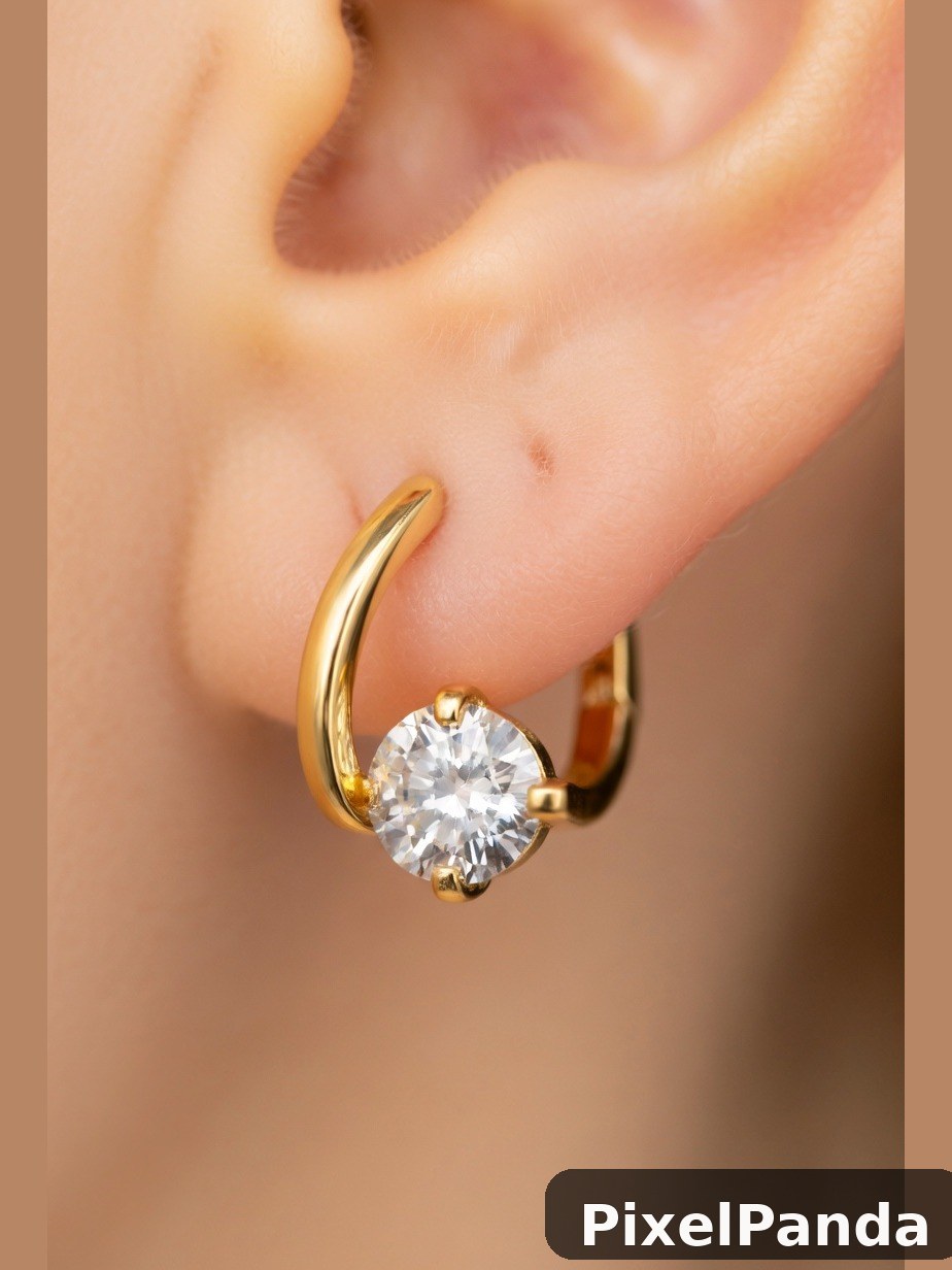 Gold hoop earring with round diamond stone on ear