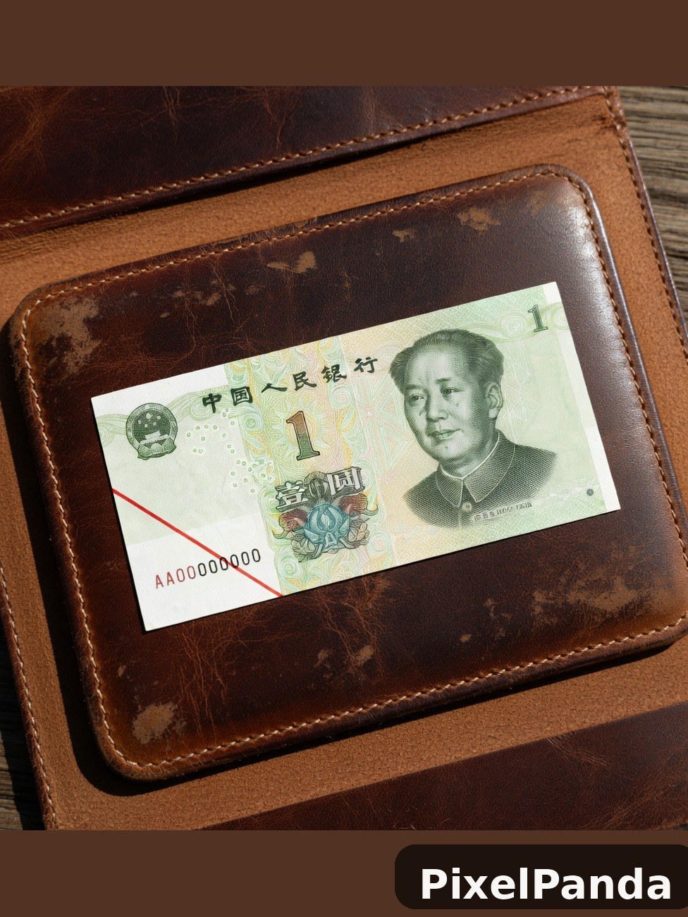 Chinese one yuan banknote in brown leather wallet