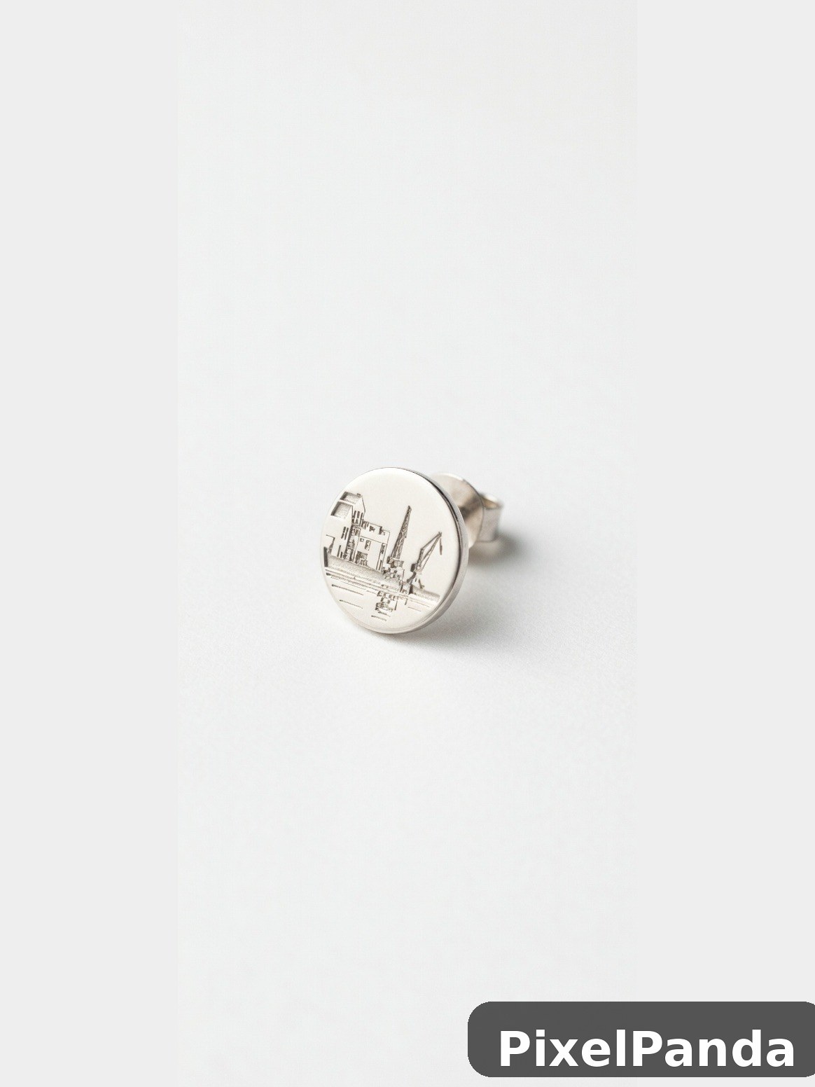 Silver ring with engraved cityscape and crane motif