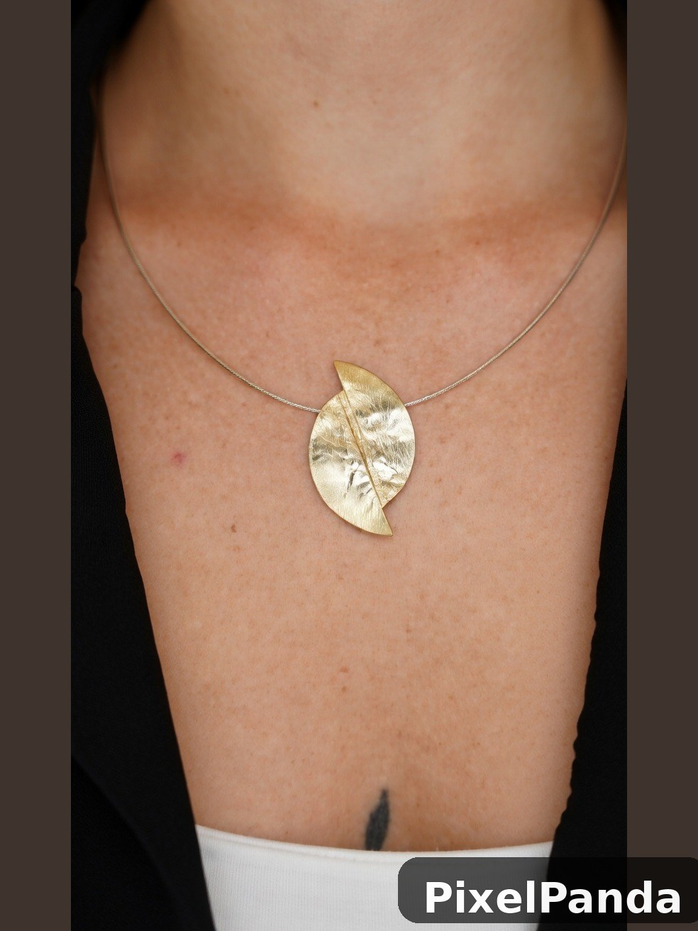Gold leaf pendant necklace on thin metal chain
