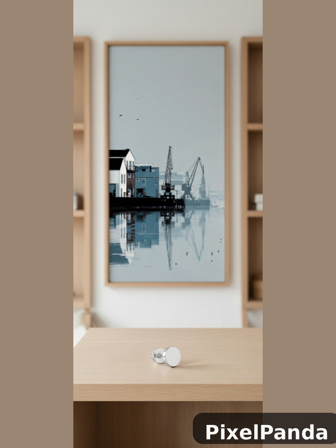 Framed industrial waterfront scene with harbor cranes and cottages