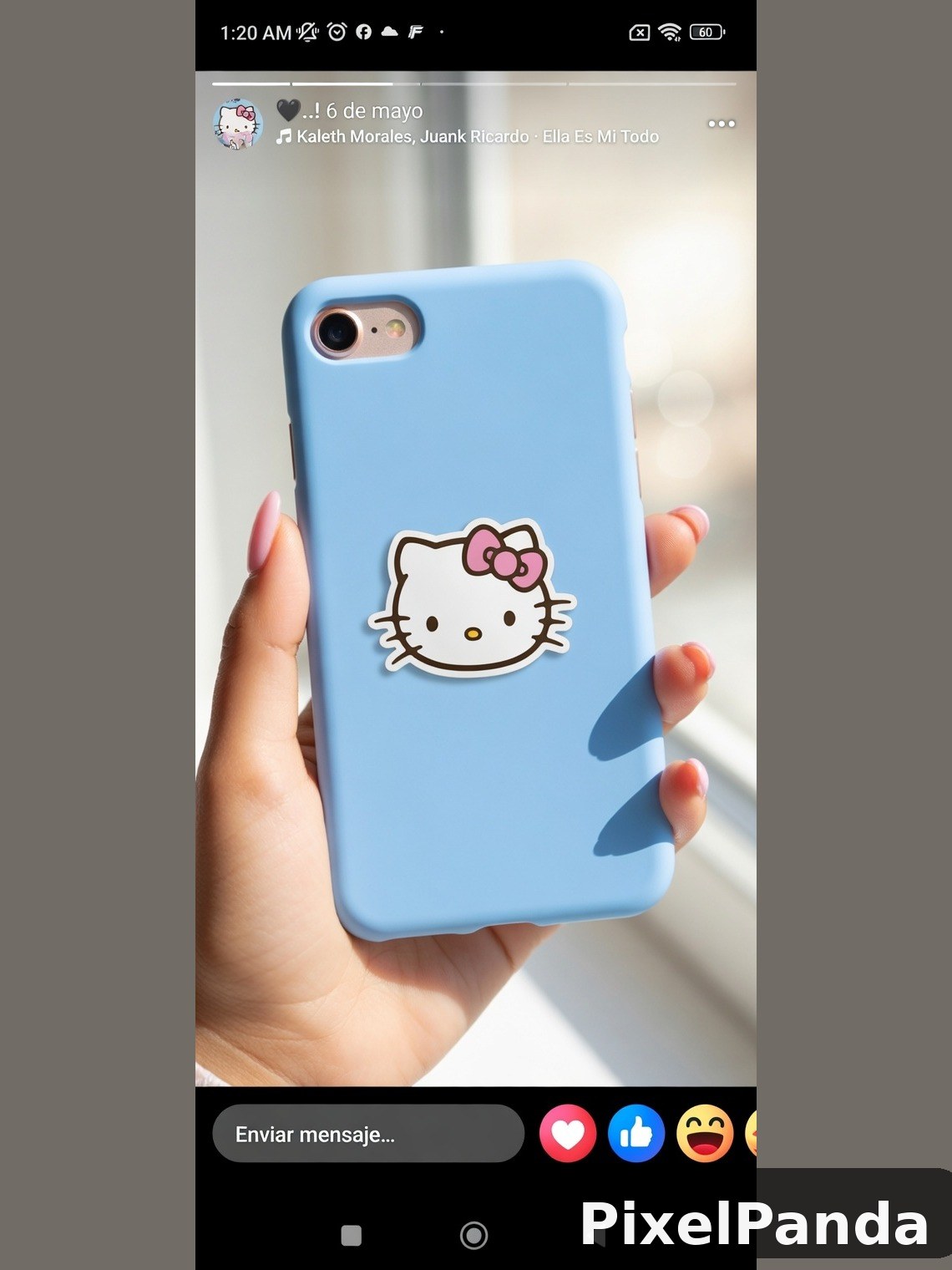 Hand holding light blue phone case with Hello Kitty design