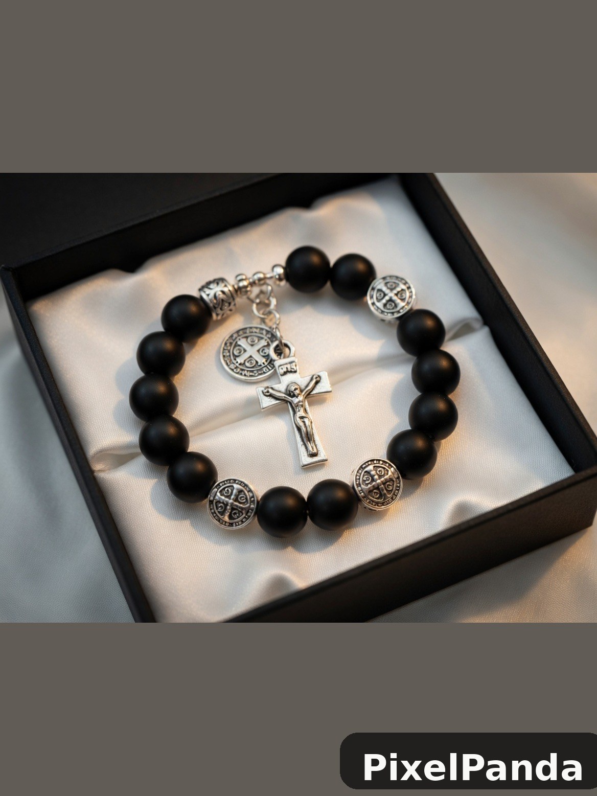 Black beaded bracelet with silver crucifix and medal charms