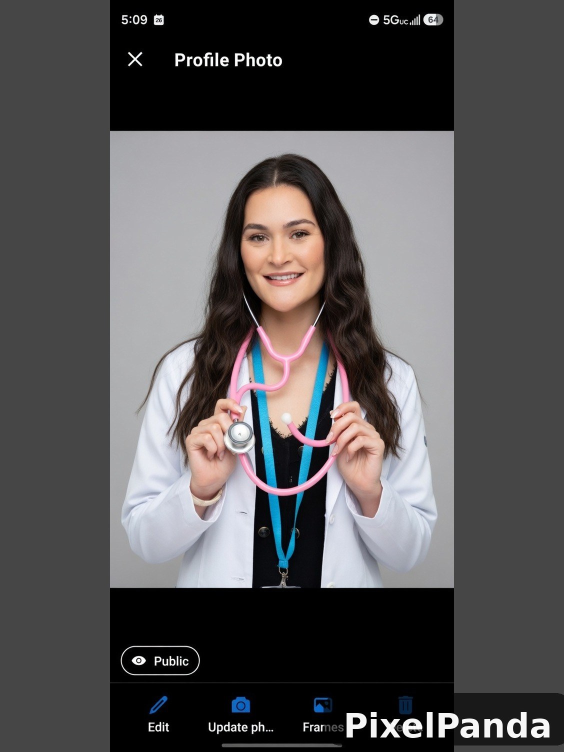 Woman in white coat holding pink and blue stethoscope