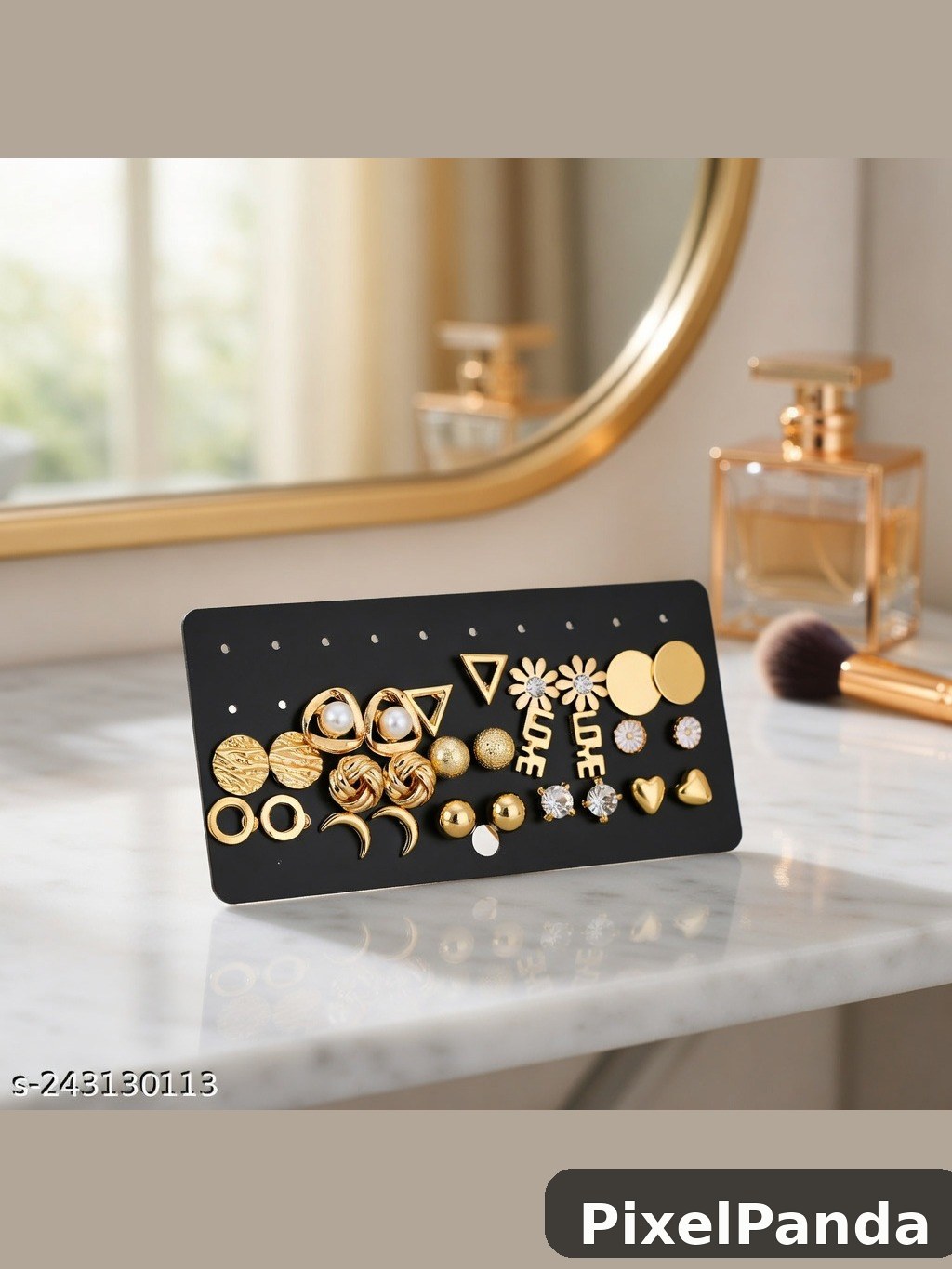 Gold and pearl stud earring collection on black display card
