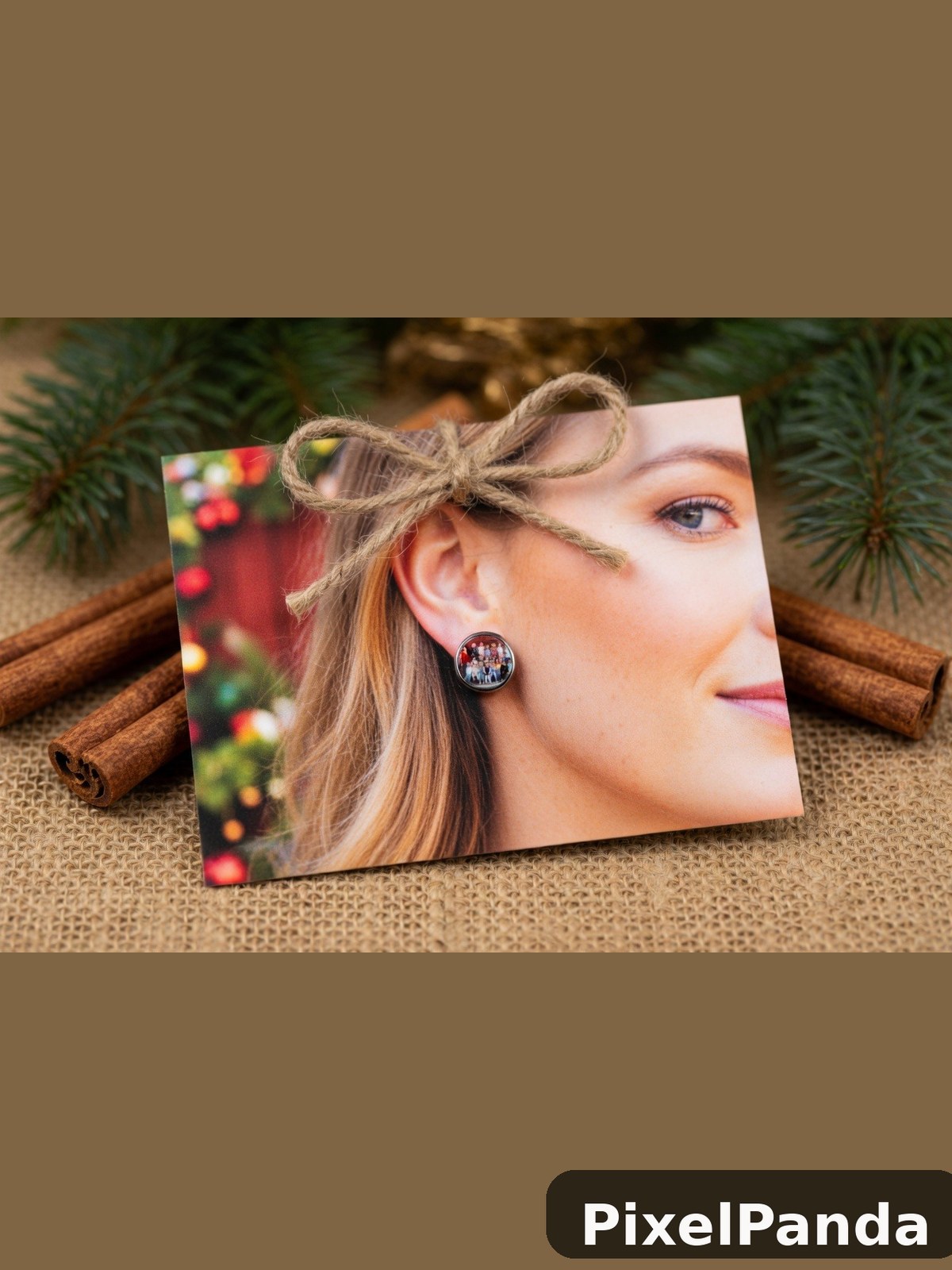 Woman with half-up hairstyle and circular earrings among holiday decorations