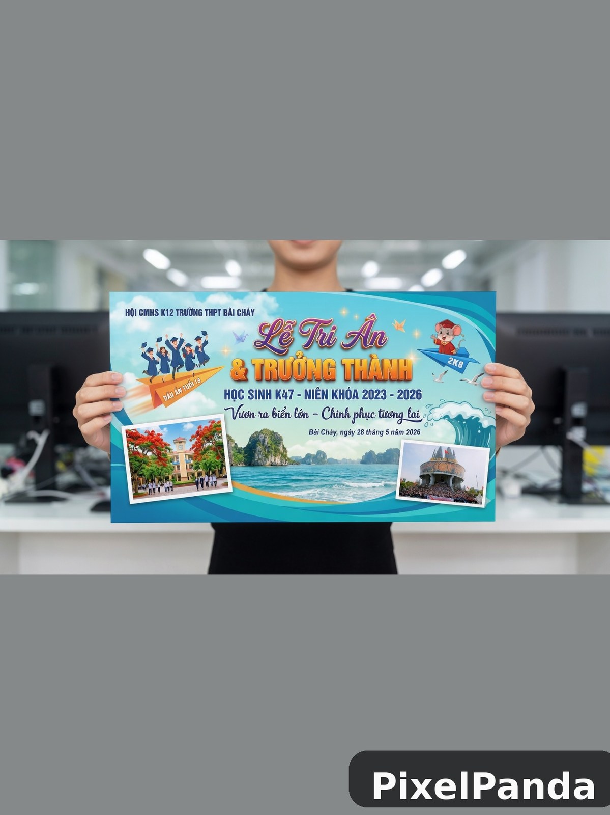 Person holding Vietnamese school graduation banner with coastal imagery