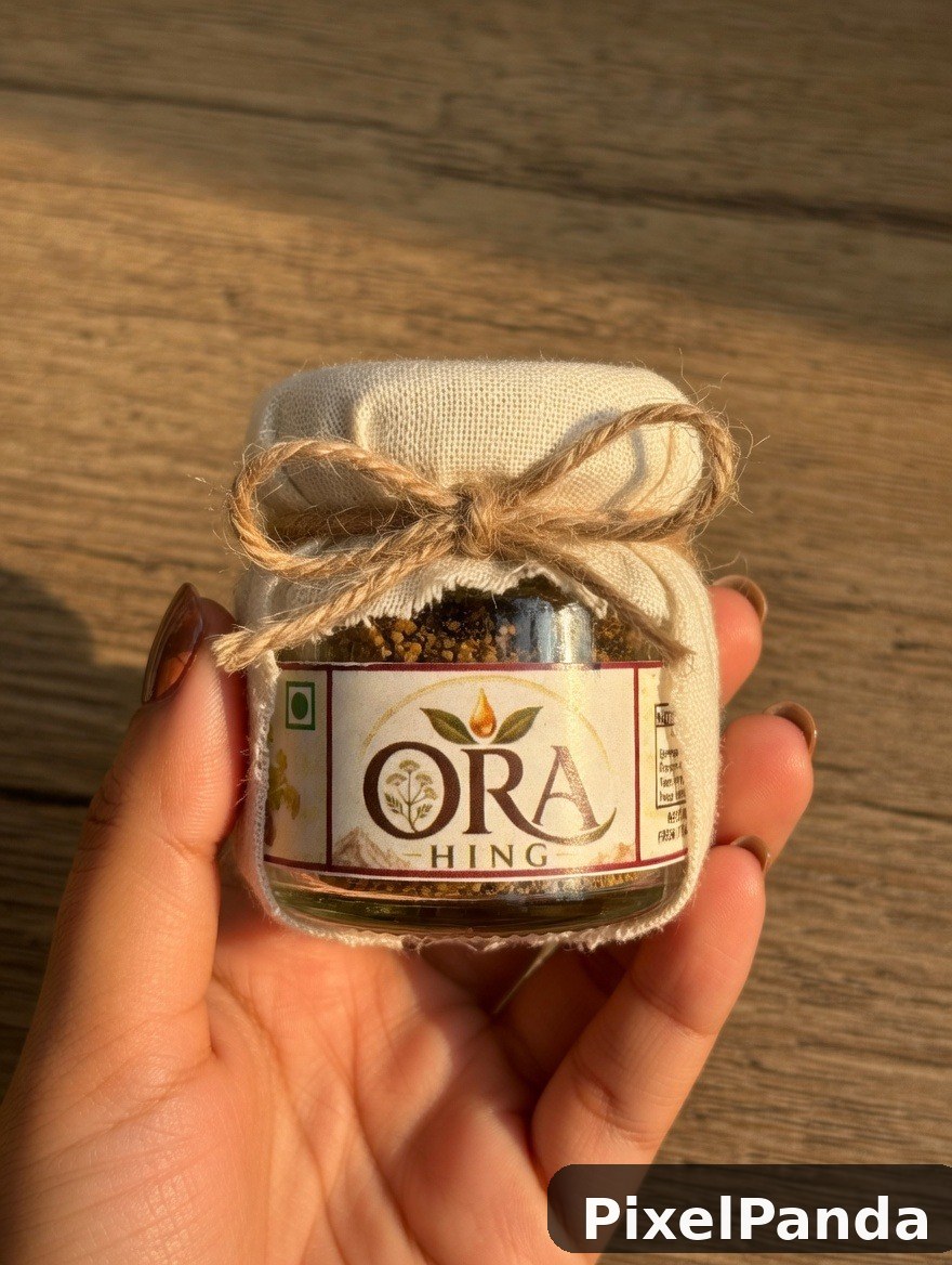 Small glass jar with twine bow held in open palm