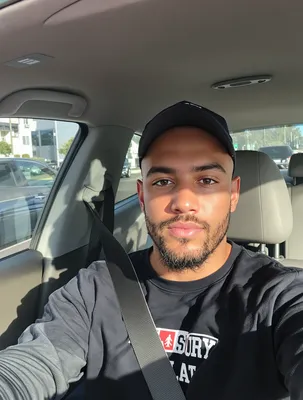 AI-generated portrait of man taking car selfie